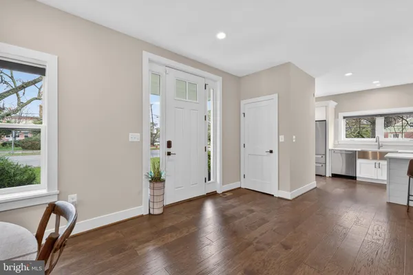 a view of a livingroom with furniture window and wooden floor