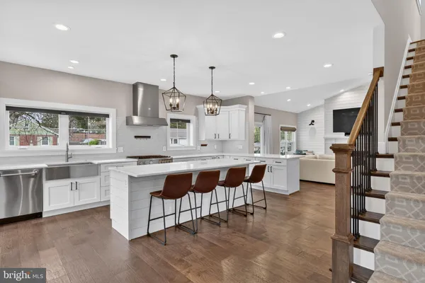 a large kitchen with lots of counter space and windows