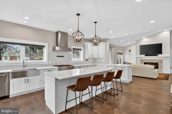 a large kitchen with lots of counter space and sink