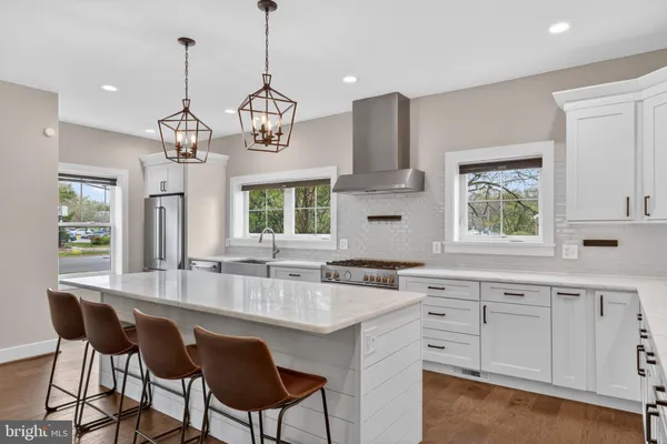 a kitchen with center island cabinets and window