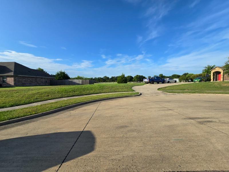 104 Anthony Lane Red Oak, TX 75154 - Photo 3 of 6 Spacious corner lot with a gentle slope and mature landscaping