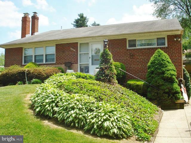 3714 Leverton Street Silver Spring, MD 20906 - Photo 1 of 24 a front view of a house with garden
