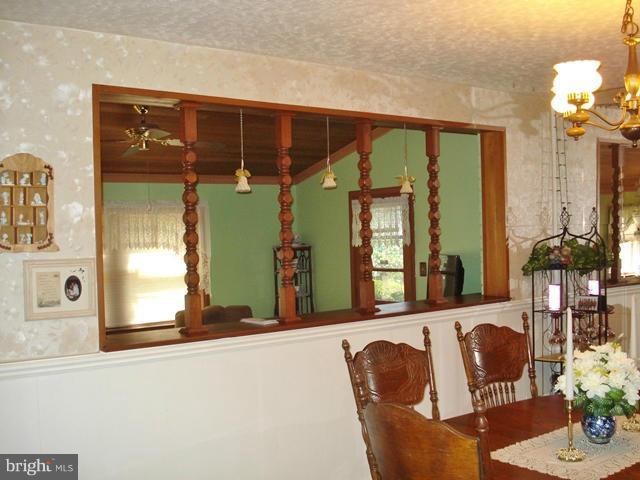 3714 Leverton Street Silver Spring, MD 20906 - Photo 16 of 24 a living room with furniture and potted plant
