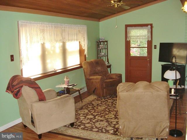 3714 Leverton Street Silver Spring, MD 20906 - Photo 17 of 24 a living room with furniture and a flat screen tv