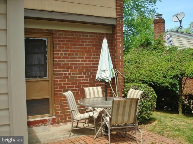 3714 Leverton Street Silver Spring, MD 20906 - Photo 23 of 24 a view of a patio with table and chairs and potted plants