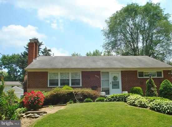3714 Leverton Street Silver Spring, MD 20906 - Photo 24 of 24 a front view of a house with a garden