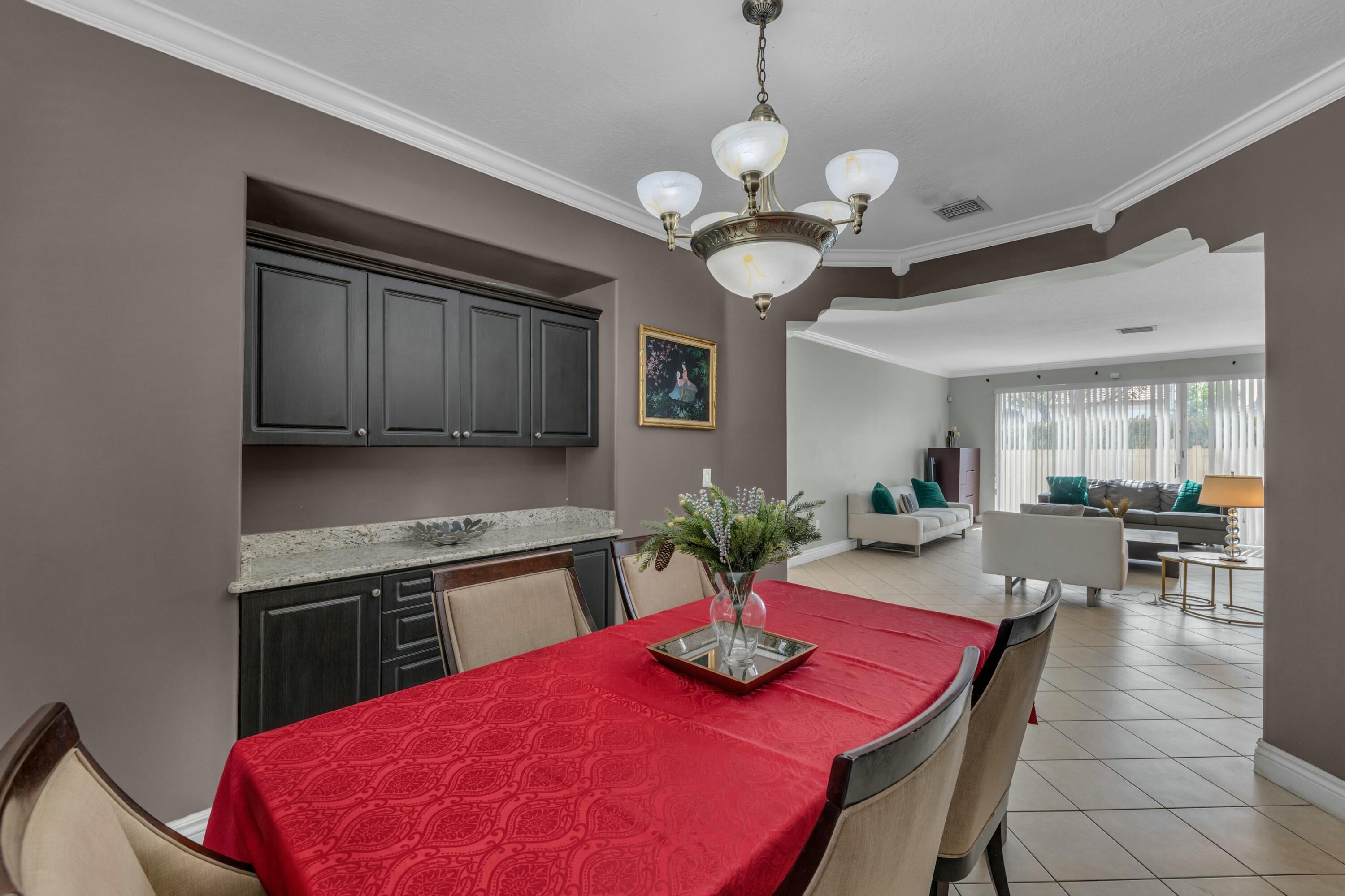 9895 Shepard Place Wellington, FL 33414 - Photo 12 of 60 a view of a dining room with furniture