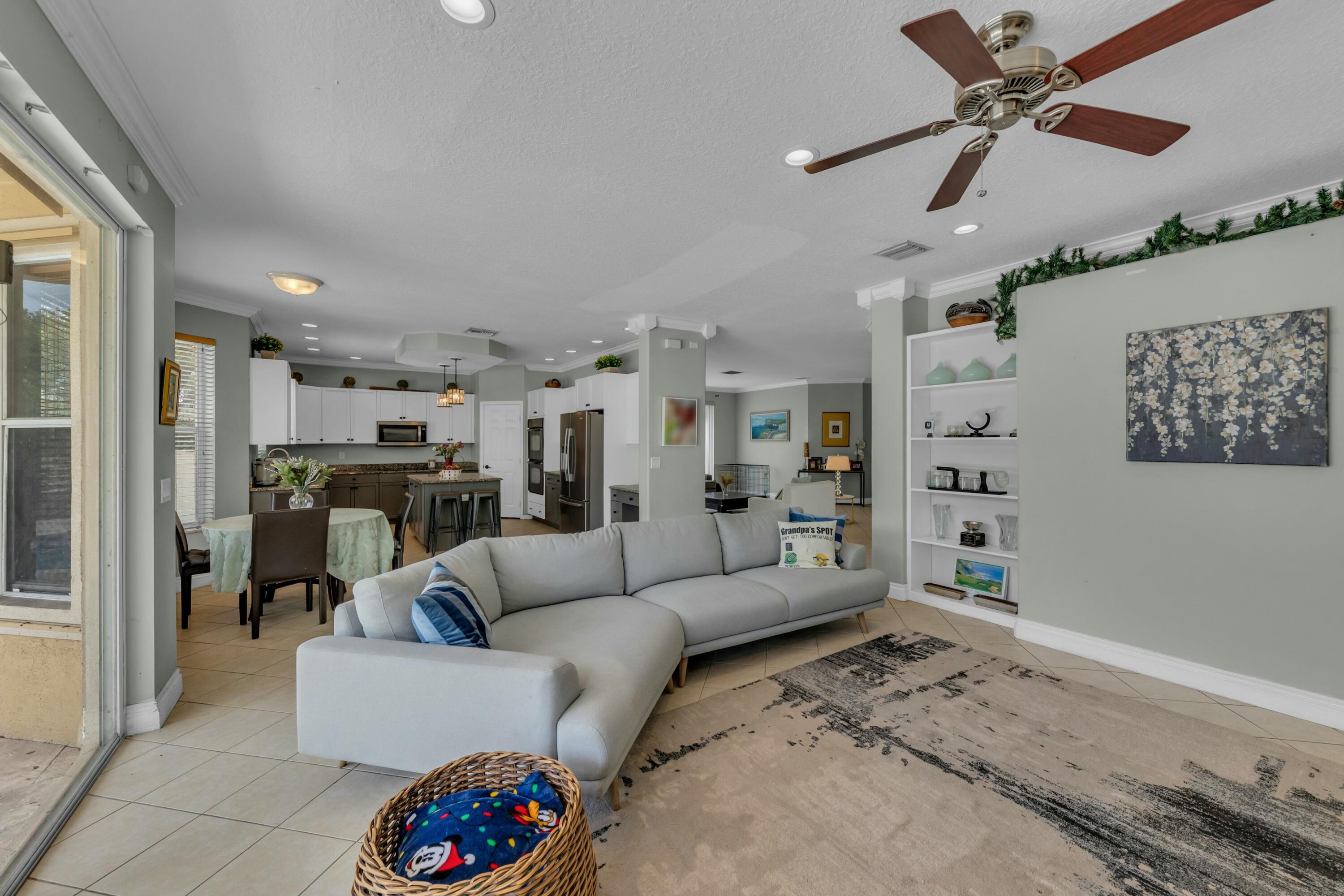 9895 Shepard Place Wellington, FL 33414 - Photo 25 of 60 a living room with furniture and kitchen view