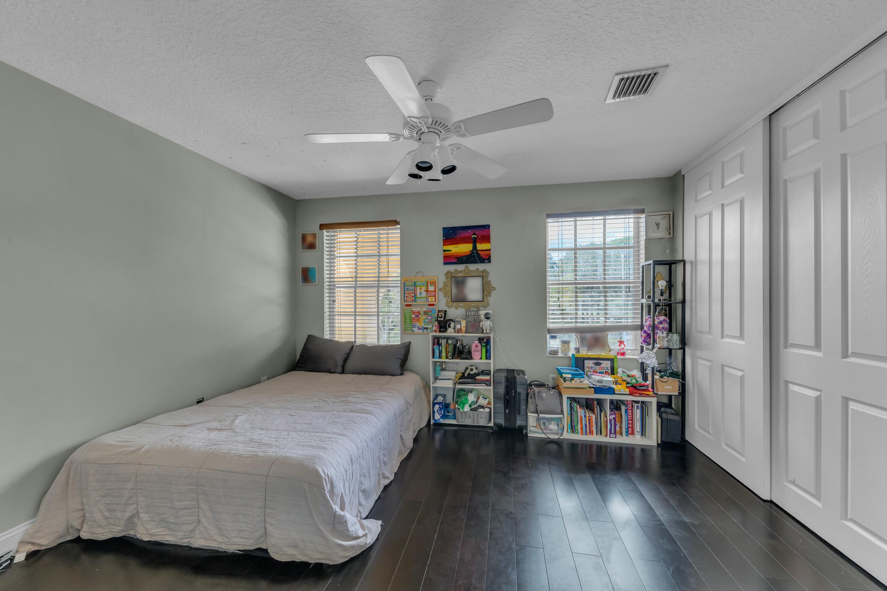 9895 Shepard Place Wellington, FL 33414 - Photo 26 of 60 a bedroom with furniture and a window