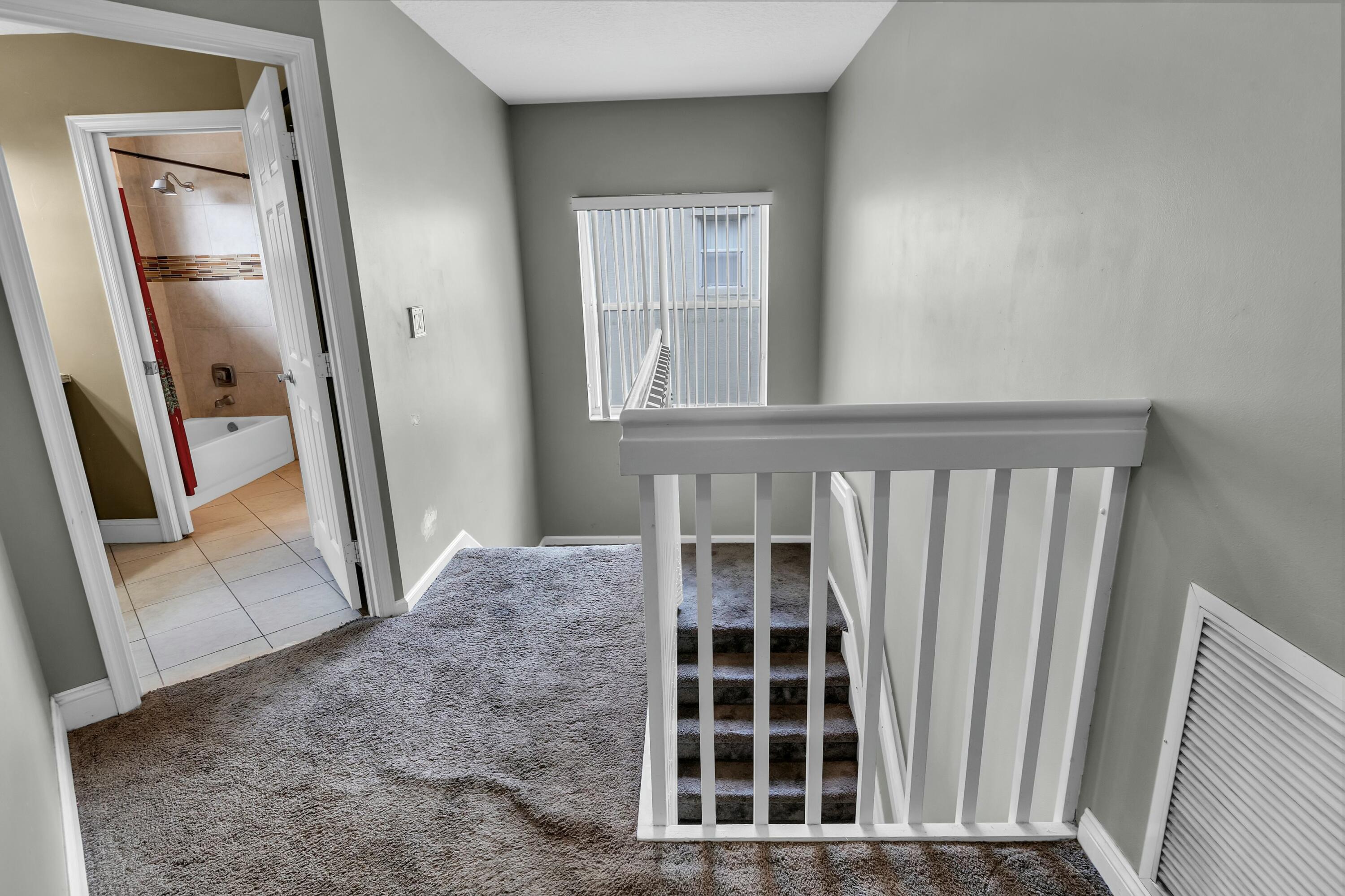 9895 Shepard Place Wellington, FL 33414 - Photo 45 of 60 STAIRWAY BY SECOND FLOOR