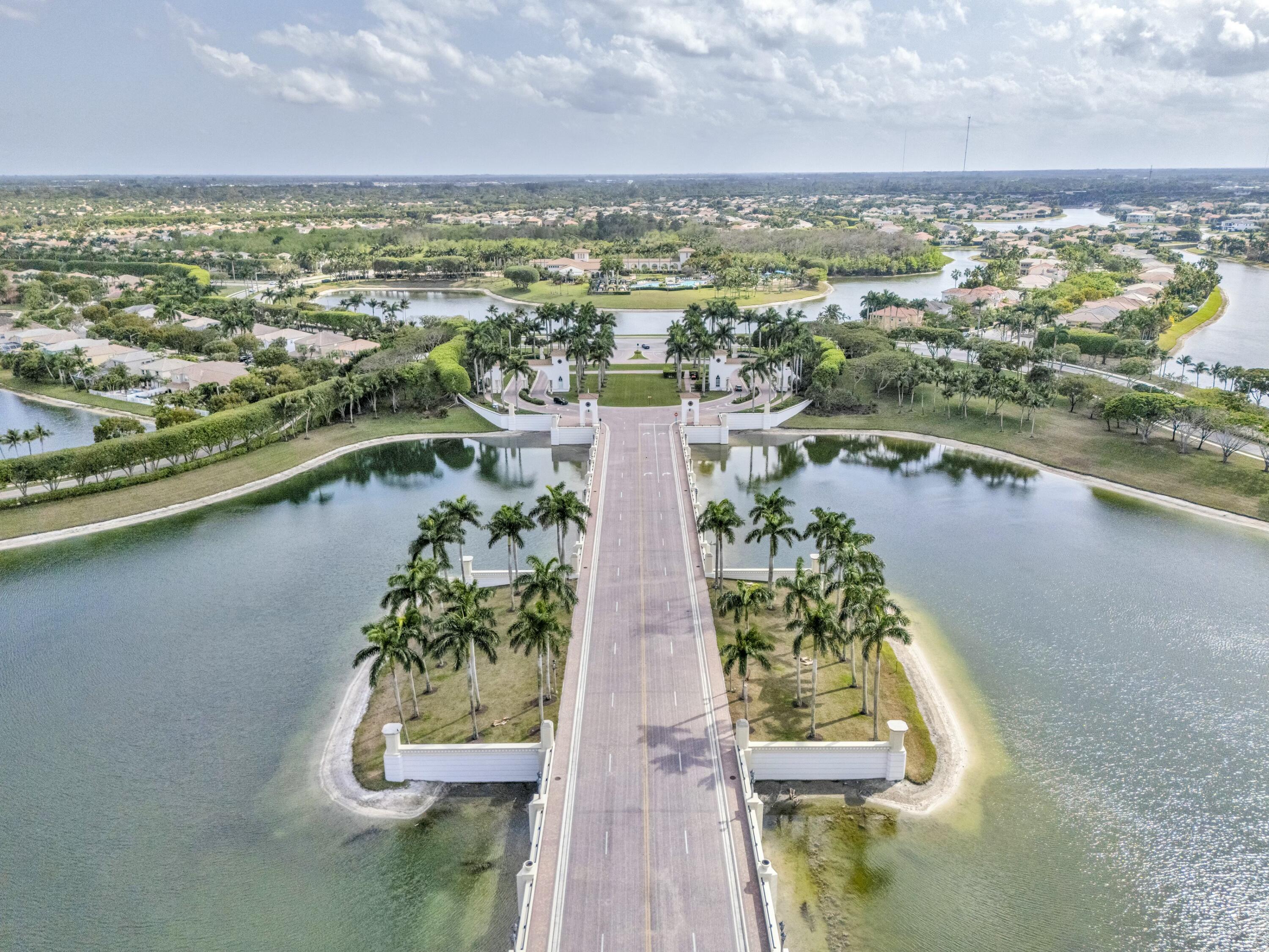 9895 Shepard Place Wellington, FL 33414 - Photo 59 of 60 an aerial view of residential houses with outdoor space and lake view