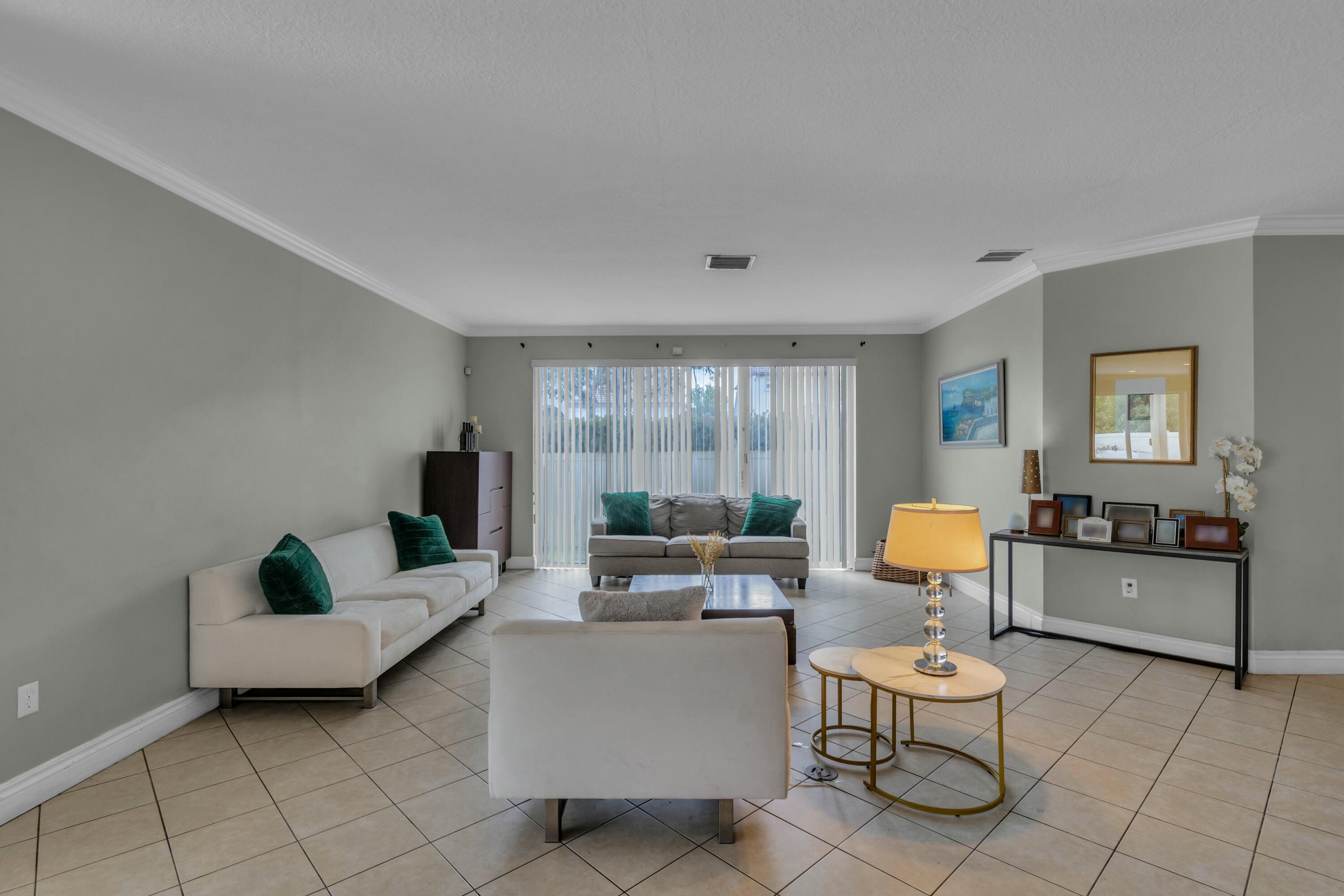 9895 Shepard Place Wellington, FL 33414 - Photo 6 of 60 a living room with furniture and wooden floor