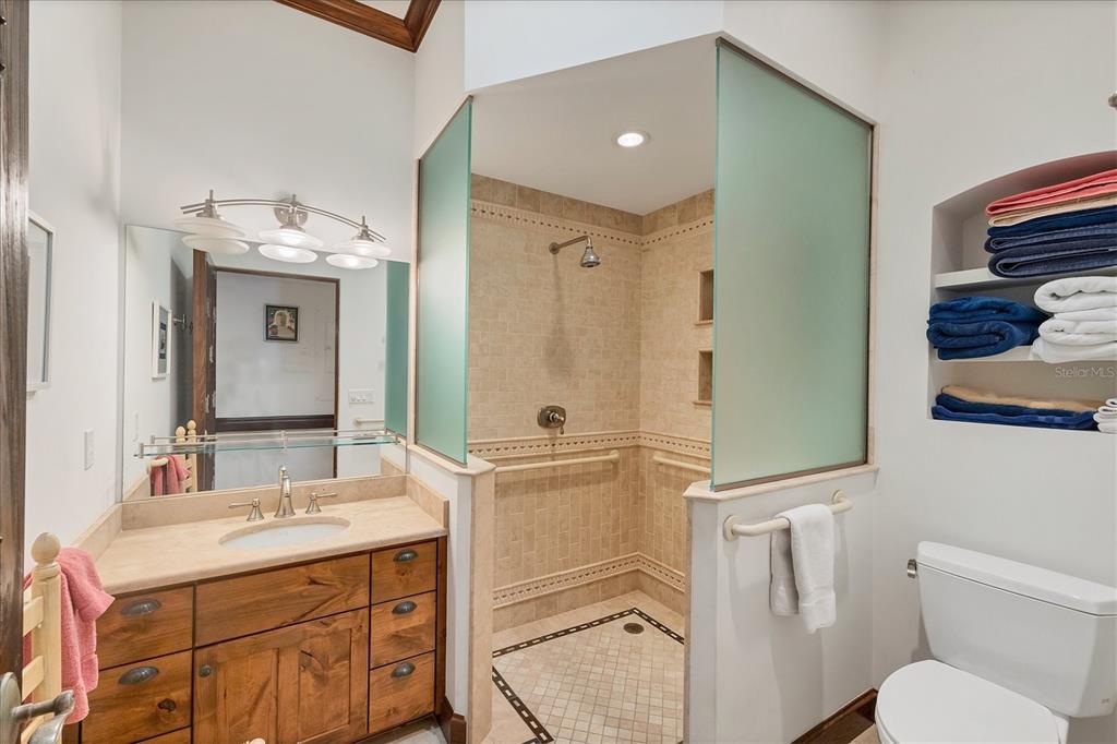 1021 10th Street West Boca Grande, FL 33921 - Photo 17 of 34 a bathroom with a sink a toilet and shower