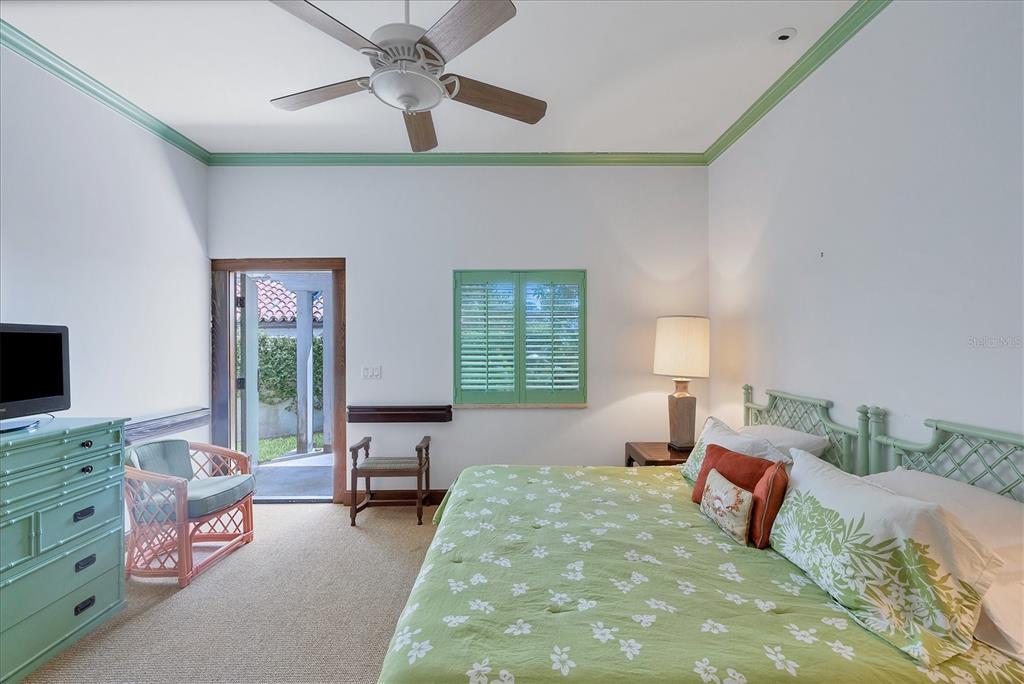 1021 10th Street West Boca Grande, FL 33921 - Photo 18 of 34 a bedroom with bed and a window