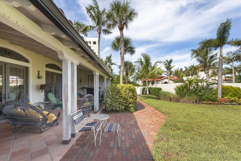 1021 10th Street West Boca Grande, FL 33921 - Photo 20 of 34 a view of a house with backyard and sitting area