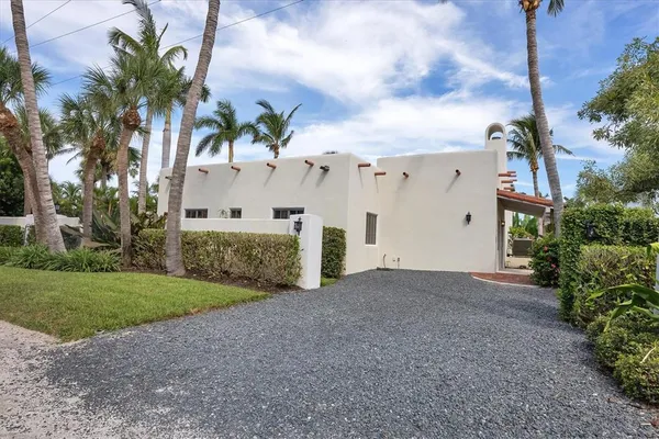 a view of a house with a yard and garage