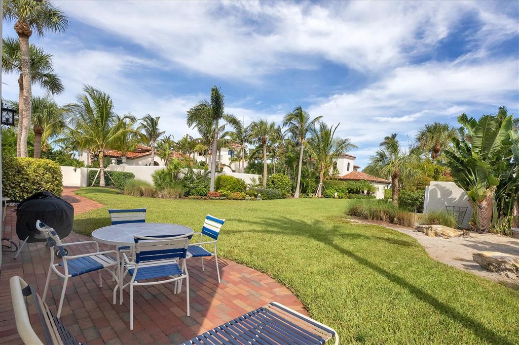 1021 10th Street West Boca Grande, FL 33921 - Photo 21 of 34 a view of a swimming pool and lounge chairs
