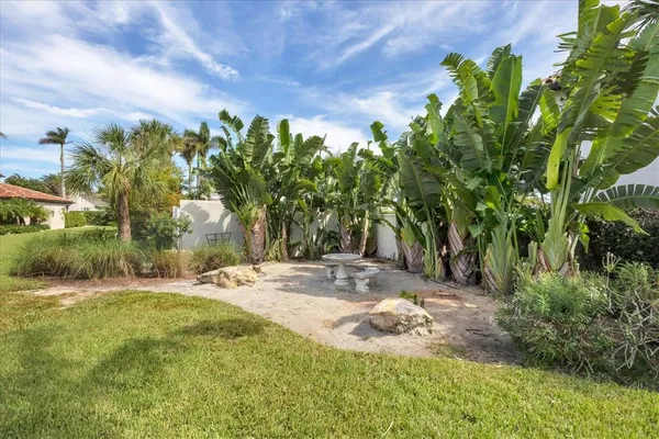 an aerial view of a house with a garden