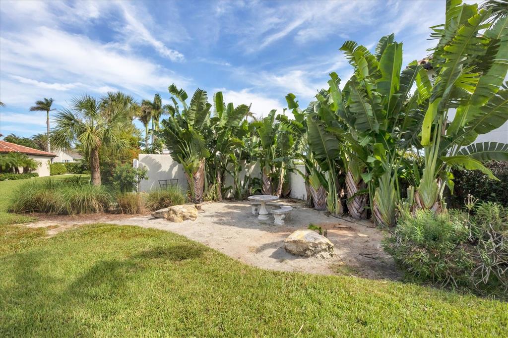 1021 10th Street West Boca Grande, FL 33921 - Photo 23 of 34 a backyard of a house with lots of green space