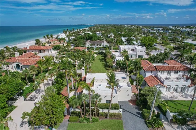 a aerial view of a house with a yard