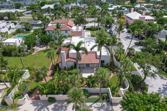 an aerial view of multiple houses with yard