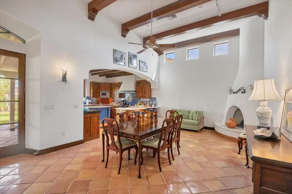 a dining room with furniture and a window