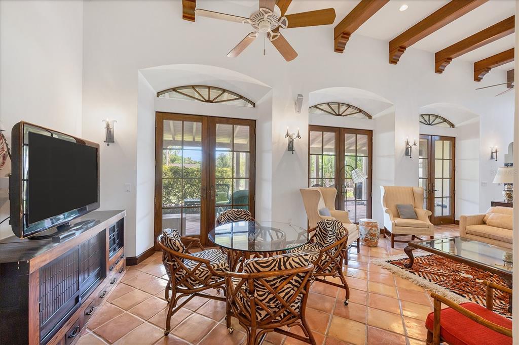 1021 10th Street West Boca Grande, FL 33921 - Photo 7 of 34 a living room with furniture and a flat screen tv