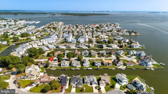 an aerial view of a house with a ocean view