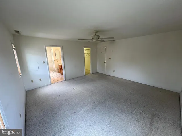 a bathroom with a sink a toilet a mirror and vanity