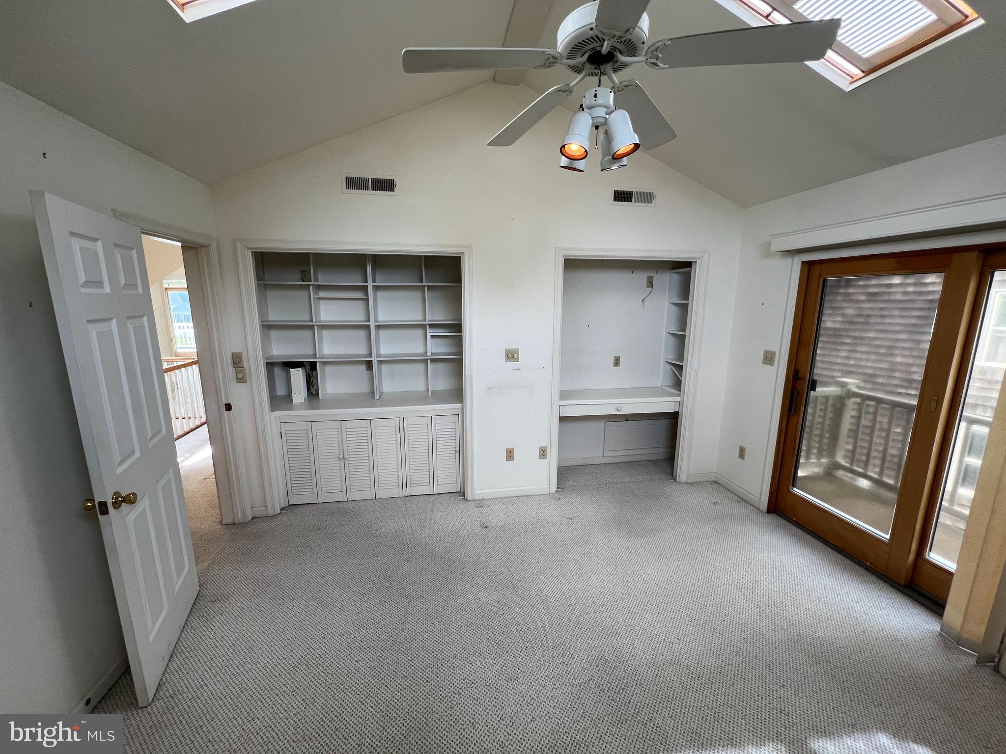 6 Ebb Tide Berlin, MD 21811 - Photo 44 of 53 a view of an empty room with a fireplace and a window
