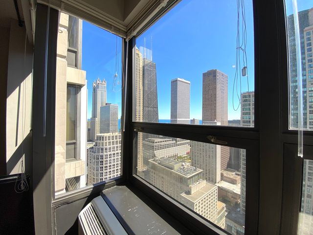 a view of a room with a large window