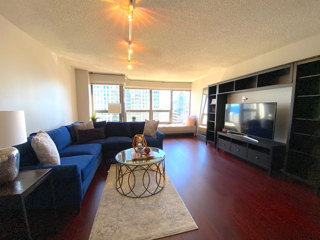 a kitchen with stainless steel appliances granite countertop a refrigerator sink and stove