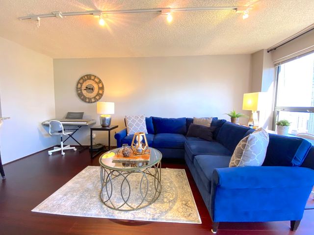 a living room with furniture and a window