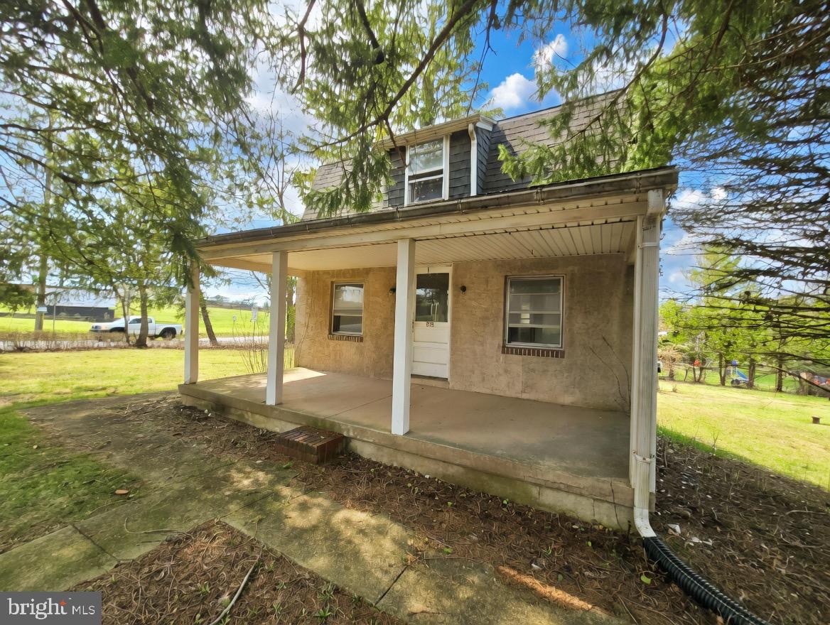 395 Evergreen Road Pottstown, PA 19464 - Photo 1 of 5 a view of a house with backyard and trees
