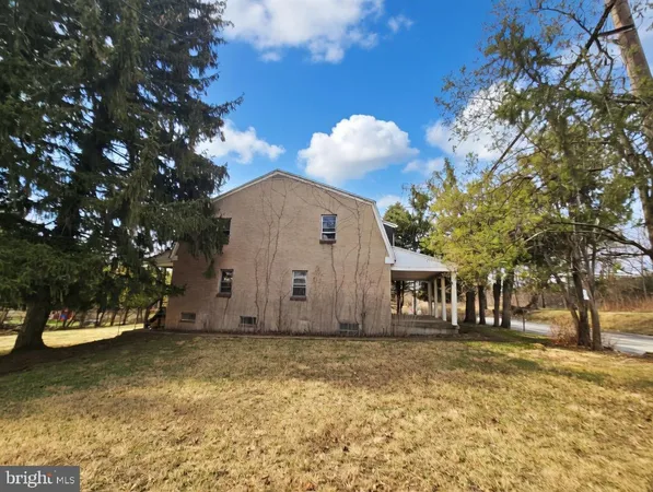 a view of a wooden house with a yard