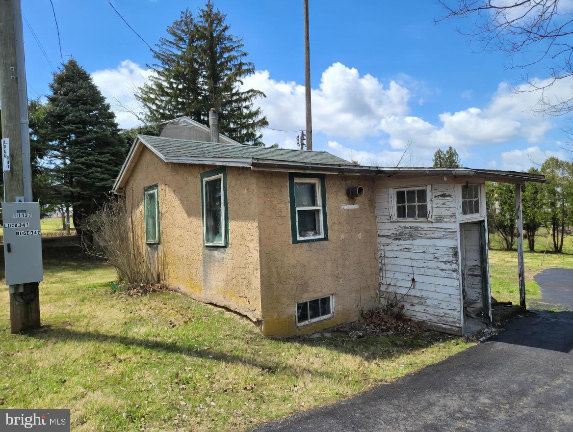 395 Evergreen Road Pottstown, PA 19464 - Photo 4 of 5 a view of a wooden house with a yard