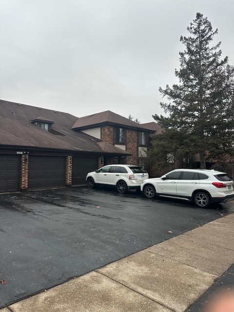 3341 West 184th Street, Unit 1B Homewood, IL 60430 - Photo 2 of 32 a view of street with parked cars