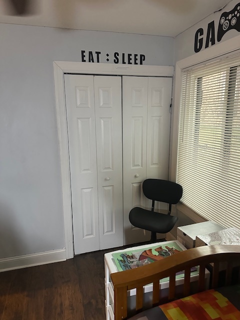 3341 West 184th Street, Unit 1B Homewood, IL 60430 - Photo 26 of 32 a bedroom with a bed and a chair