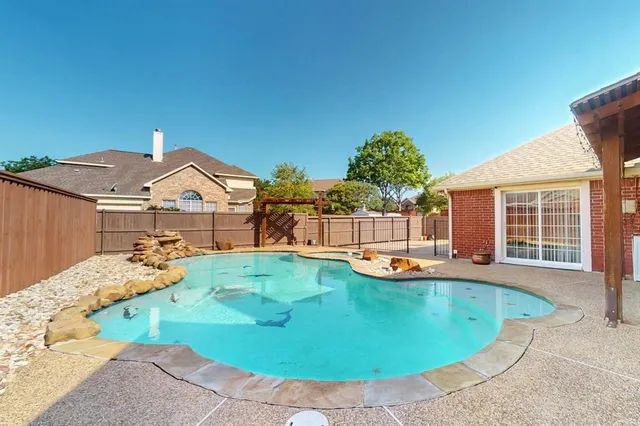 a view of a swimming pool with a lounge chairs