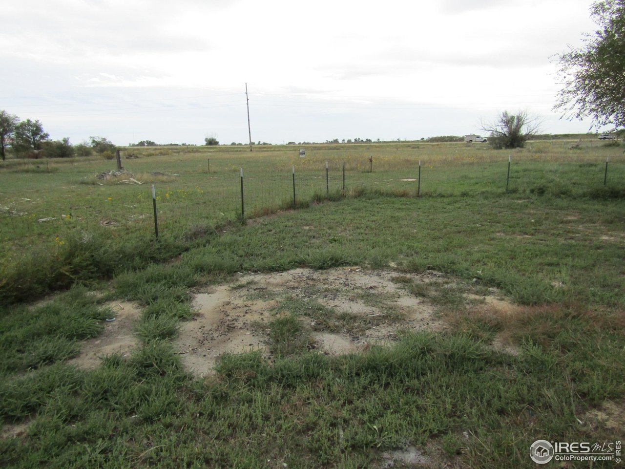 18500 Centennial Road Fort Morgan, CO 80701 - Photo 30 of 37 View of acreage looking south past the fenced yard from the house. Fenced in yard shown
