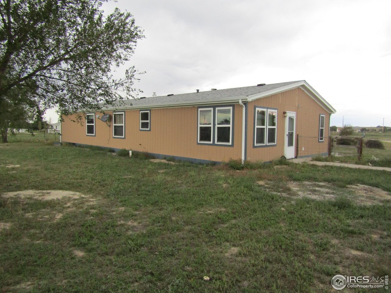 18500 Centennial Road Fort Morgan, CO 80701 - Photo 31 of 37 South and east side of house from inside fenced yard