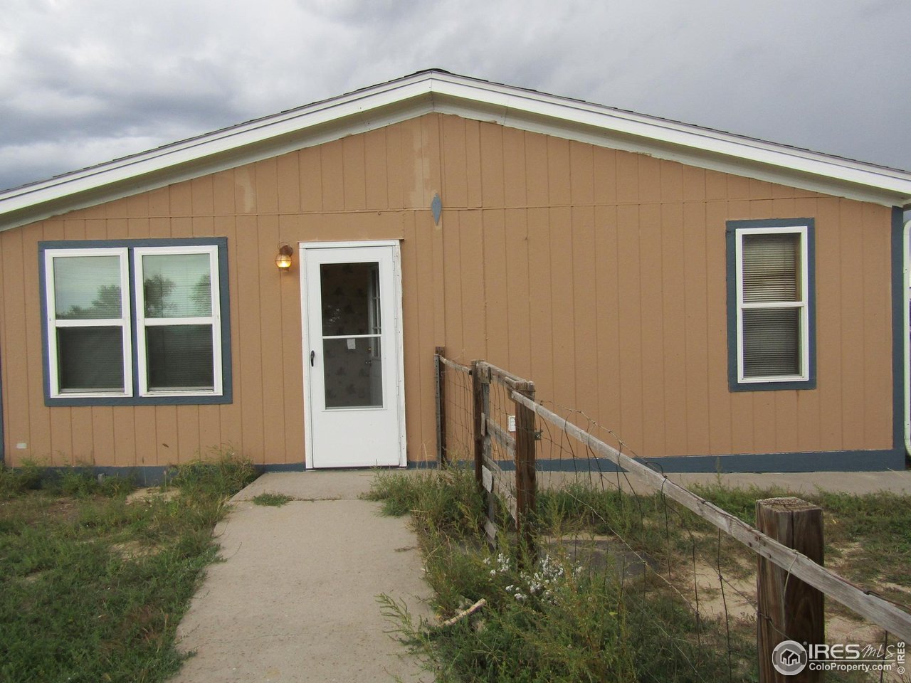 18500 Centennial Road Fort Morgan, CO 80701 - Photo 32 of 37 View of east side door of house from garage.