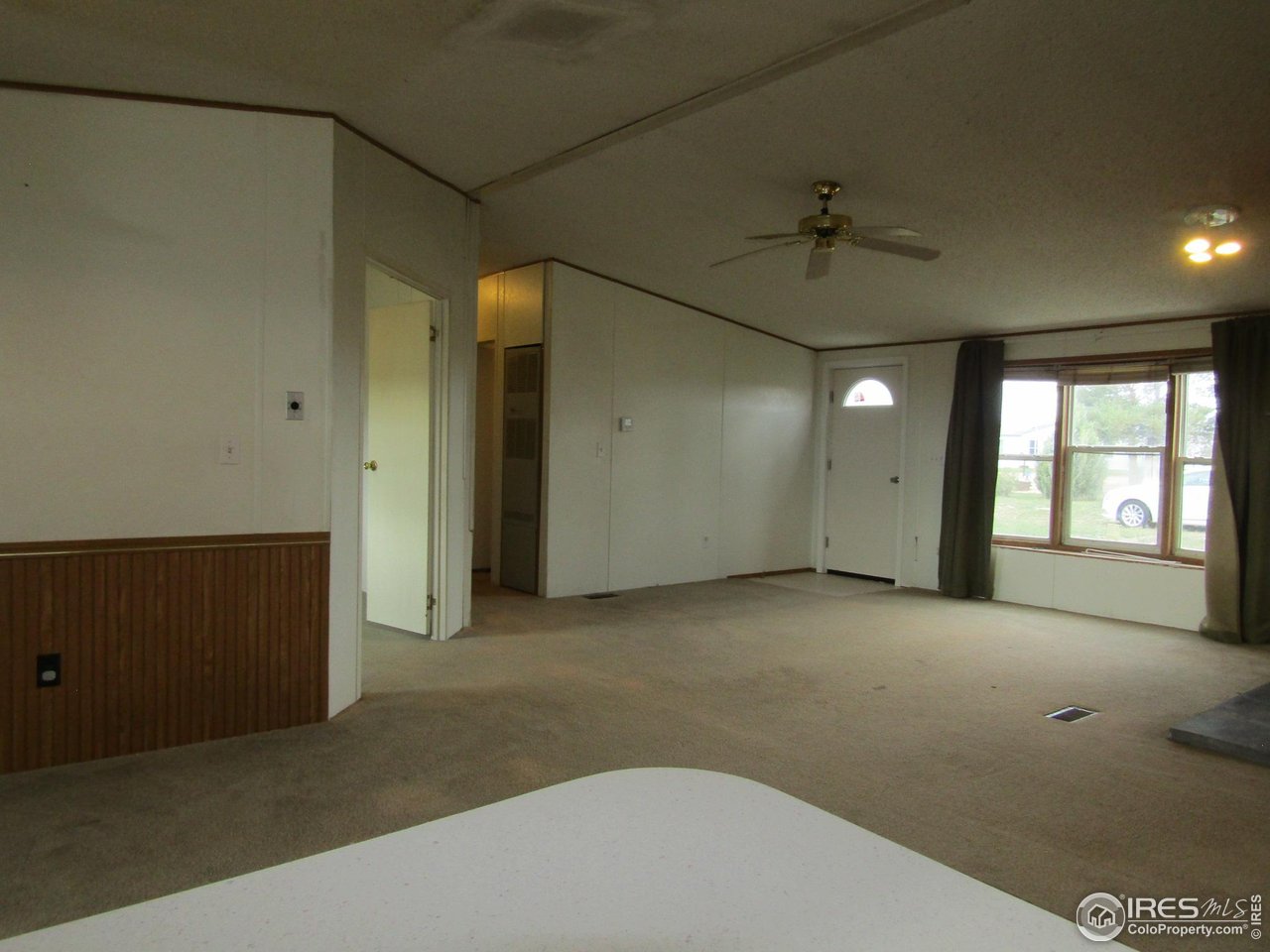 18500 Centennial Road Fort Morgan, CO 80701 - Photo 10 of 37 View of living room from kitchen/front door in background.