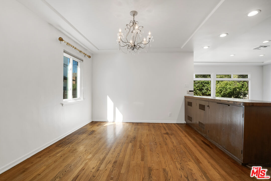 1617 Reeves Street Los Angeles, CA 90035 - Photo 16 of 55 wooden floor in an empty room with a window