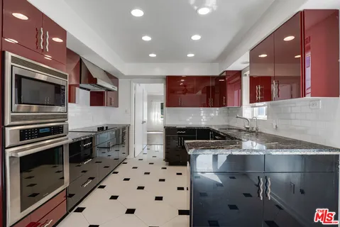 a bathroom with a shower and a sink