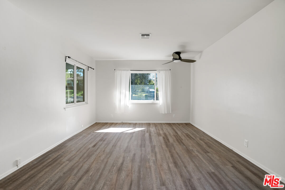 1617 Reeves Street Los Angeles, CA 90035 - Photo 25 of 55 wooden floor in an empty room with a window