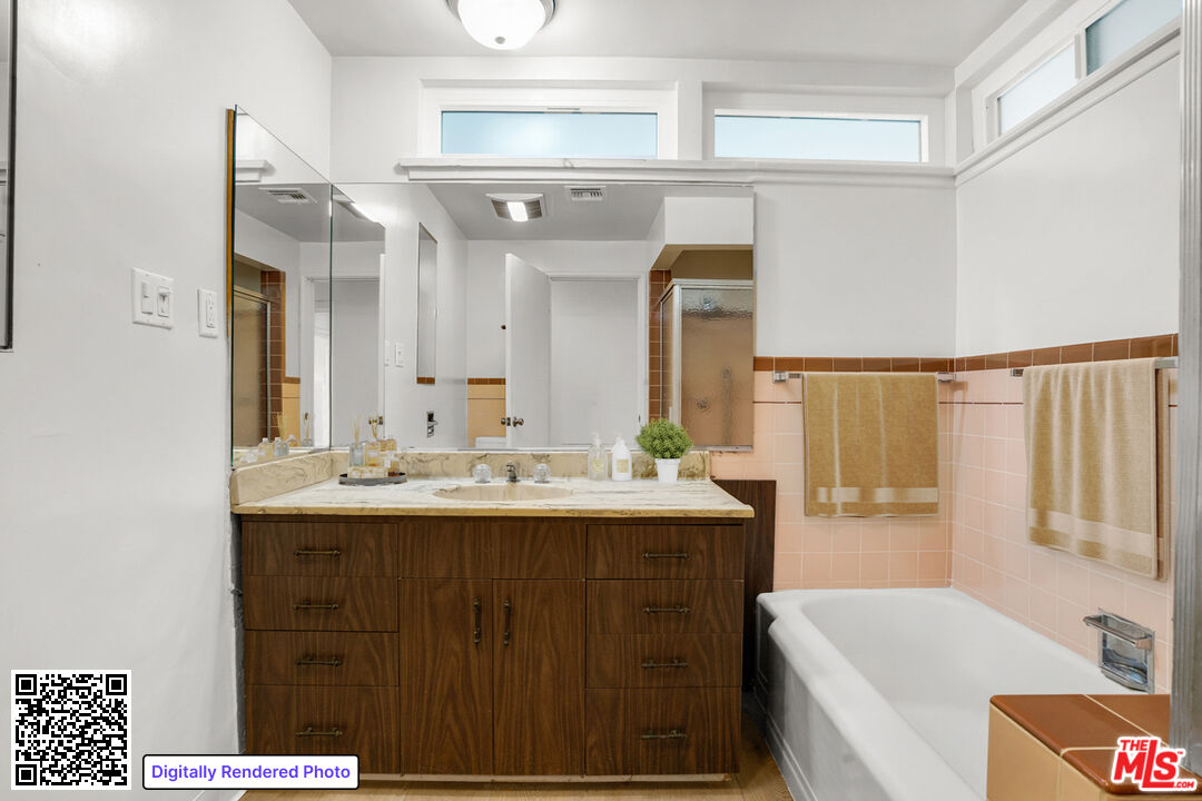 1617 Reeves Street Los Angeles, CA 90035 - Photo 29 of 55 a bathroom with a tub sink and mirror