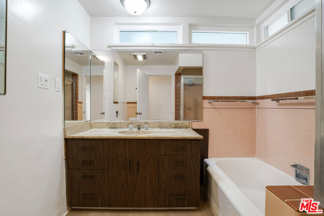 1617 Reeves Street Los Angeles, CA 90035 - Photo 30 of 55 a bathroom with a sink and a mirror
