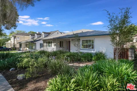 a living room with fireplace furniture and a flat screen tv
