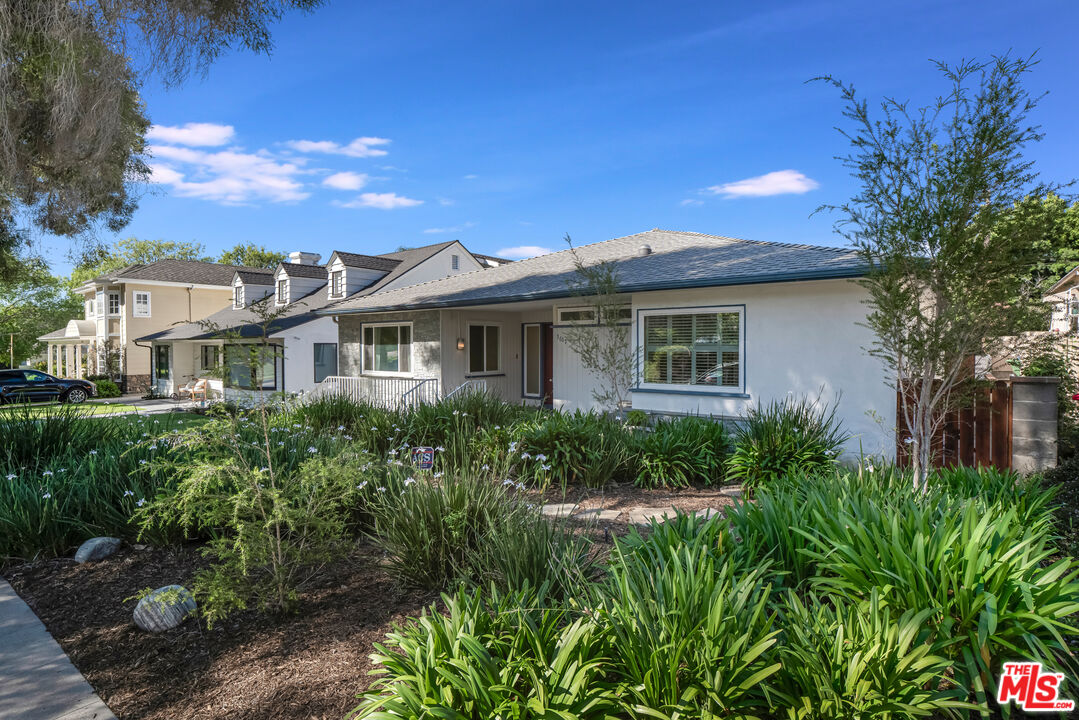 1617 Reeves Street Los Angeles, CA 90035 - Photo 3 of 55 a front view of a house with a garden